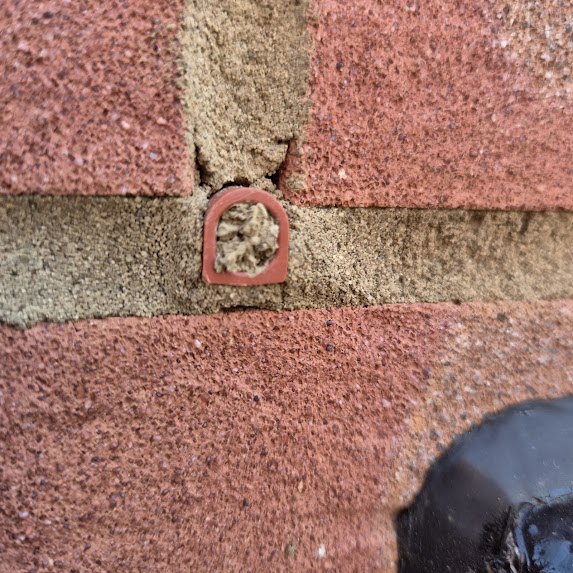 Blocked weep hole identified during a snagging inspection